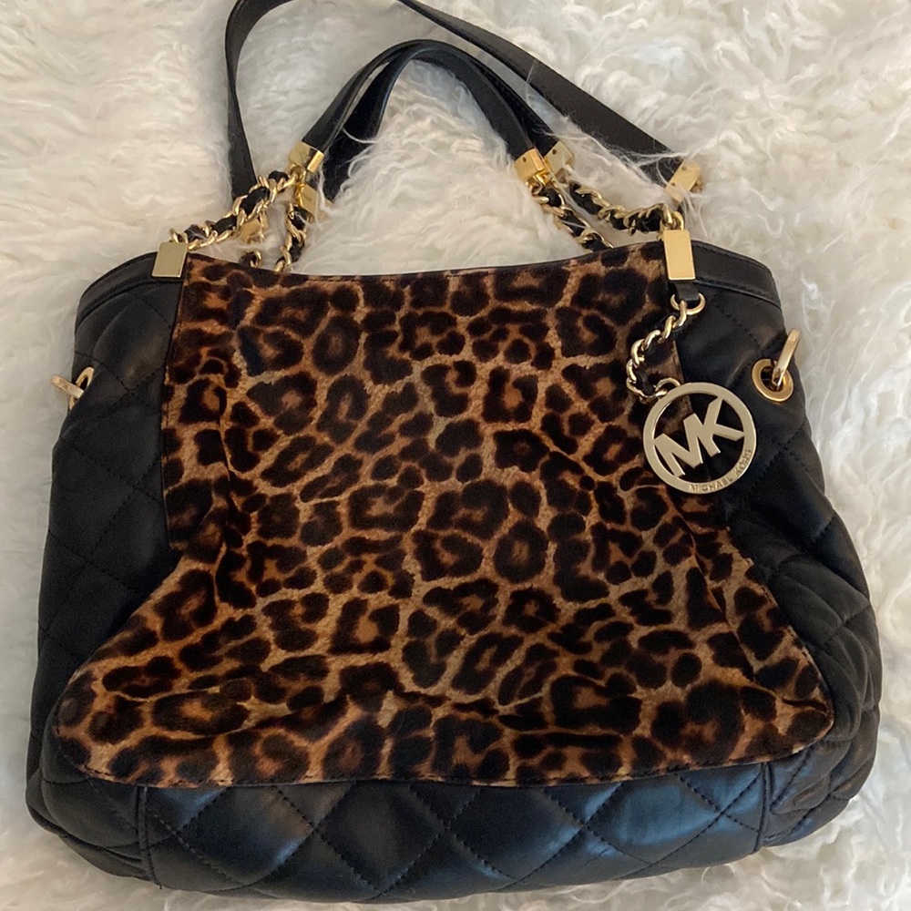 Michael Kors cheetah and black leather handbag.  Perfect condition!